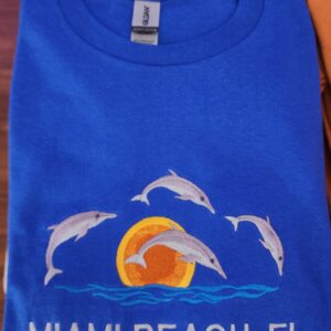 "Dolphins Dance at Sunset in Stunning Royal Blue – Miami's Hottest Tee Just Dropped!" / 100% Cotton Embroidered Unisex T-Shirt